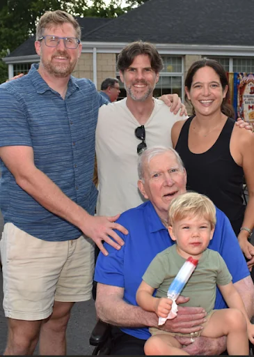 A Beechwood resident with his family and young grandson at a summer event